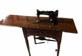 Vintage Singer Sewing Machine in cabinet