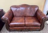 Brown soft leather loveseat