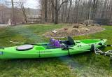 Kayak, paddle, life vest, and wheels