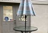 glass patio table set with umbrella