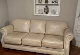 cream colored leather sleeper couch