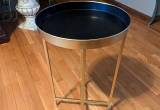 gold and black end table tray table